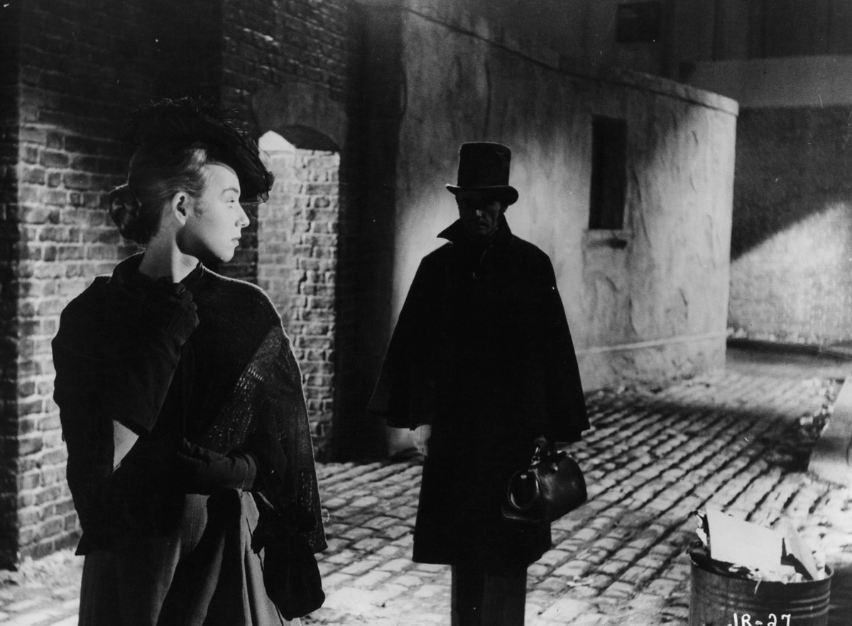 Unknown actress looking back at a man following her in a scene from the film 'Jack The Ripper', 1959. (Photo by Paramount/Getty Images)