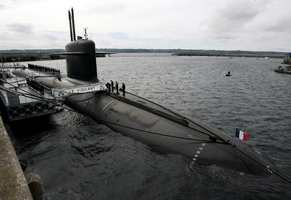 FILE - In this July 13, 2007 file photo, French Marine officers wait atop "Le Vigilant" nuclear submarine at L'Ile Longue military base, near Brest, Brittany. (AP Photo/Francois Mori, P ...