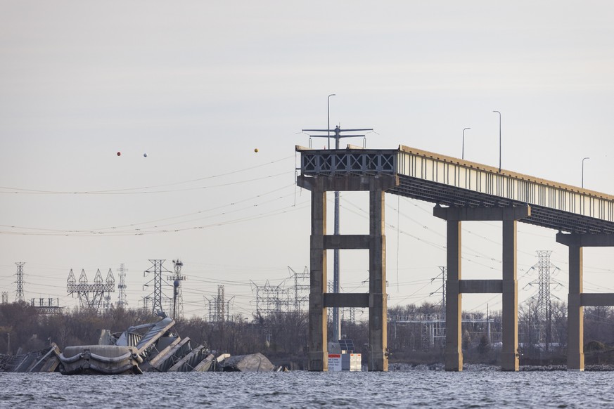 epa11244381 The Francis Scott Key Bridge left partially collapsed after a cargo ship ran into it in Baltimore, Maryland, USA, 26 March 2024. The Maryland Department of Transportation confirmed that th ...