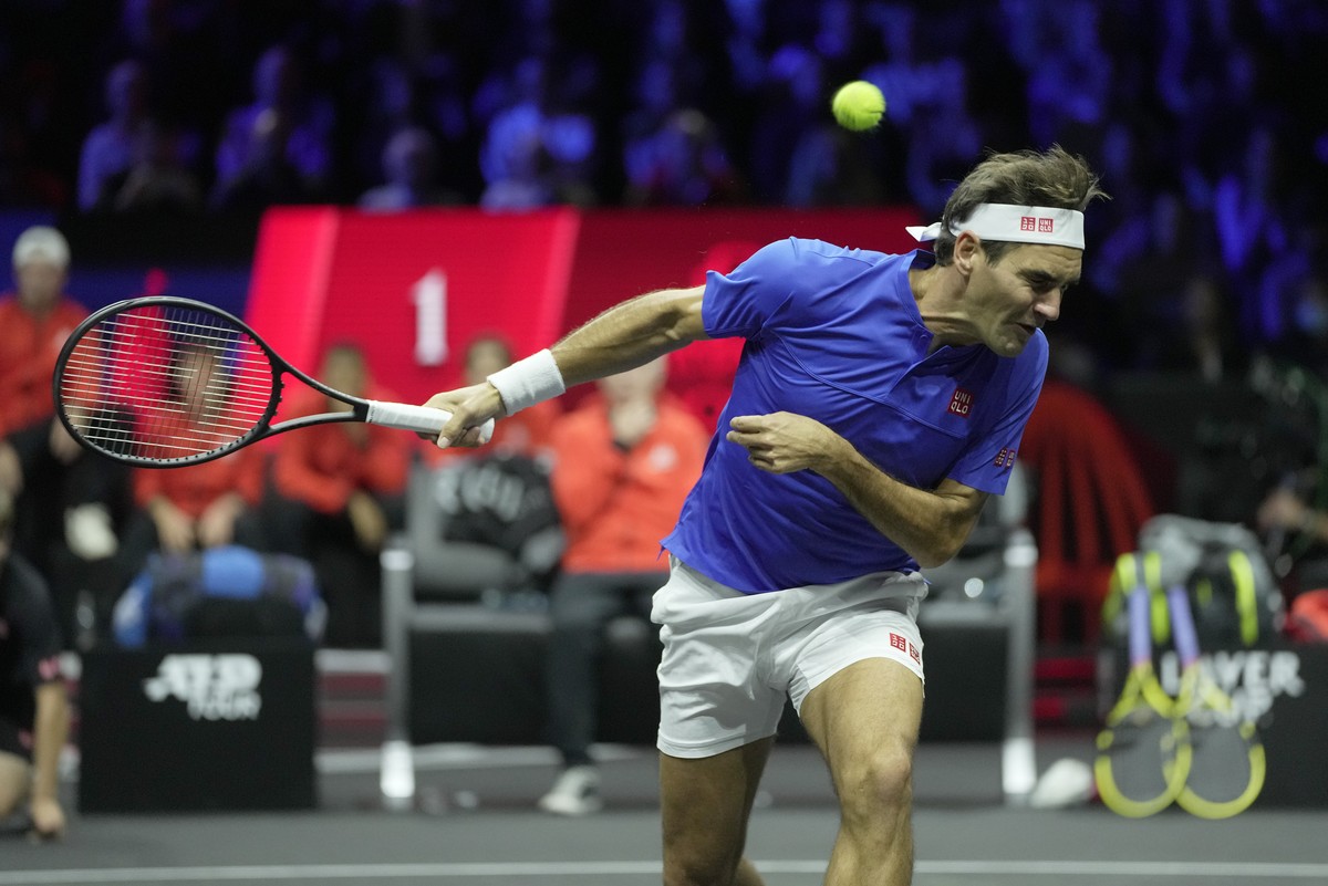 Team Europe's Roger Federer, ducks under a ball, as he plays with Rafael Nadal during their Laver Cup doubles match against Team World's Jack Sock and Frances Tiafoe at the O2 arena in Londo ...