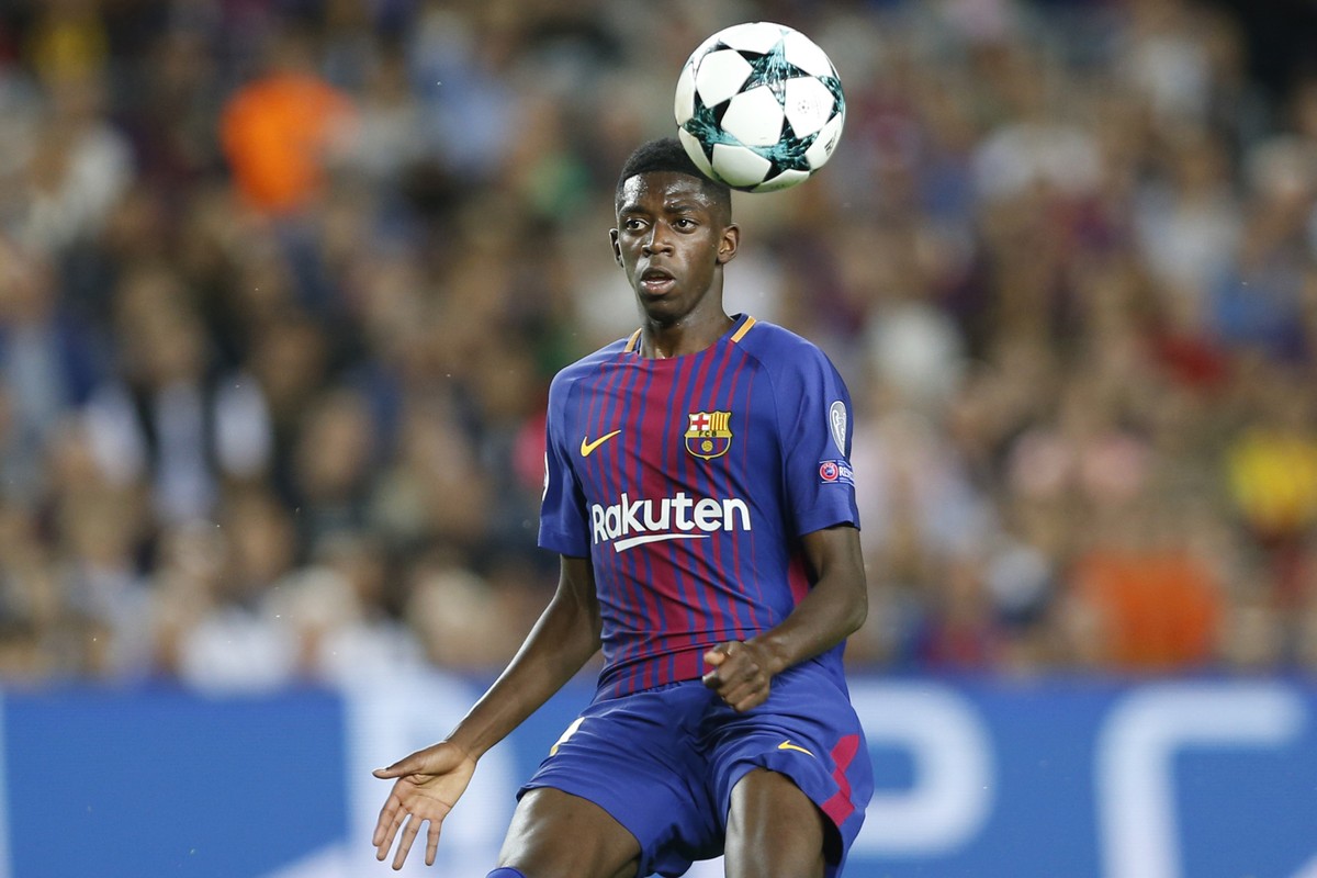 FILE - In this Sept. 12, 2017 file photo, Barcelona's Ousmane Dembele chases the ball during a Champions League group D soccer match between FC Barcelona and Juventus at the Camp Nou stadium in B ...