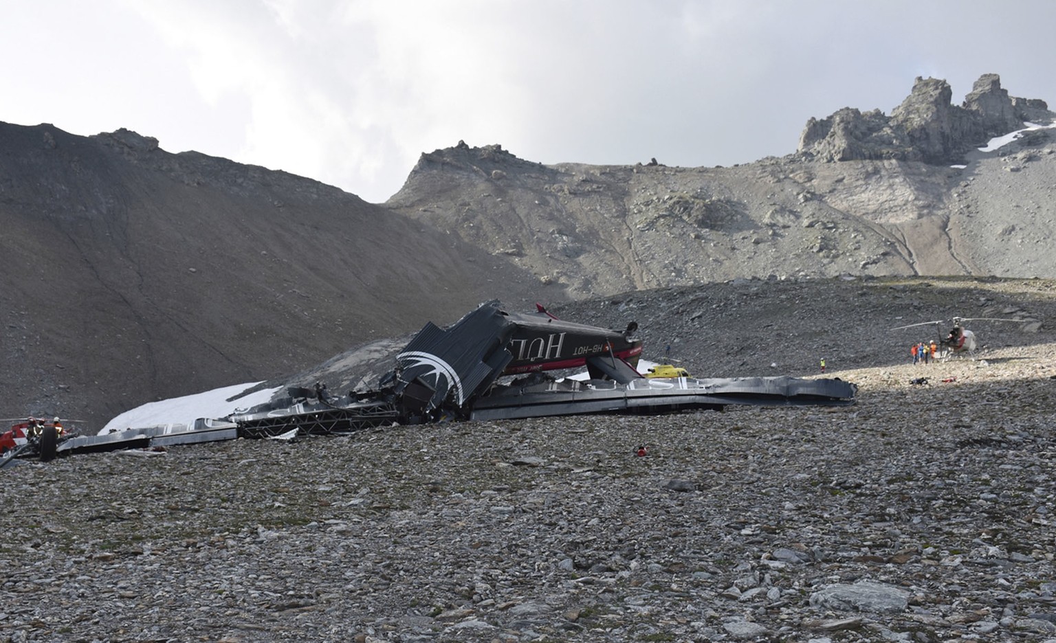 The photo provided by Police Graubuenden shows the wreckage of the old-time propeller plane Ju 52 after it went down went down Saturday Aug, 4 2018 on the Piz Segnas mountain above the Swiss Alpine re ...