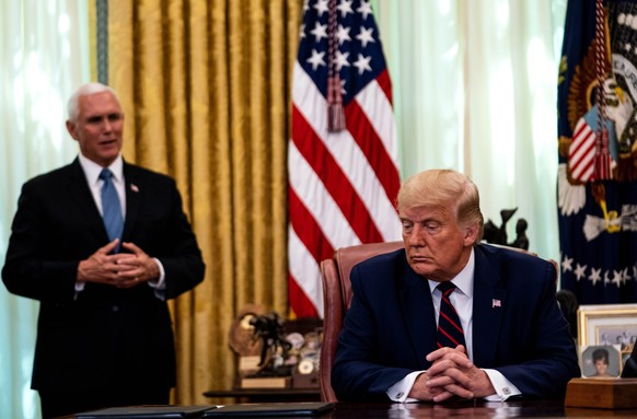 epa08931190 (FILE) - US Vice President Mike Pence (L) speaks as US President Donald J. Trump (R) participates in a signing ceremony and trilateral meeting with the President of the Republic of Serbia, ...