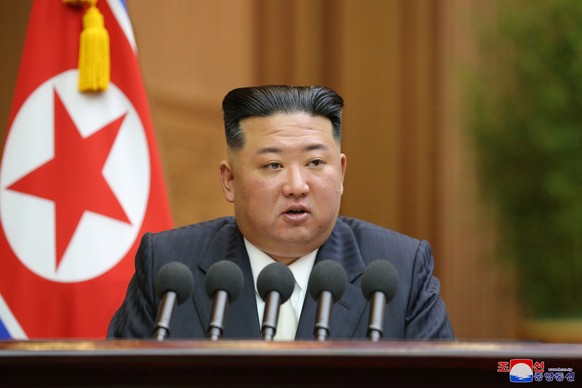 epa10172315 A photo released by the official North Korean Central News Agency (KCNA) shows North Korean leader Kim Jong-un delivering his speech during a parliament session in Pyongyang, North Korea, ...