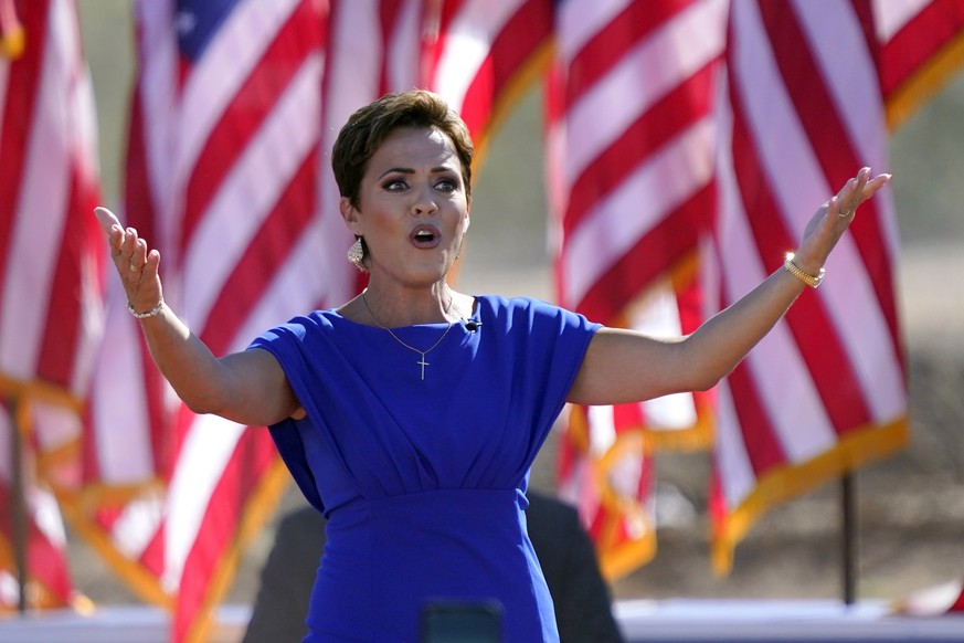 FILE - Arizona Republican gubernatorial candidate Kari Lake arrives to a rally with former President Donald Trump on Oct. 9, 2022, in Mesa, Ariz. The Republicans running for Arizona&#039;s three top s ...