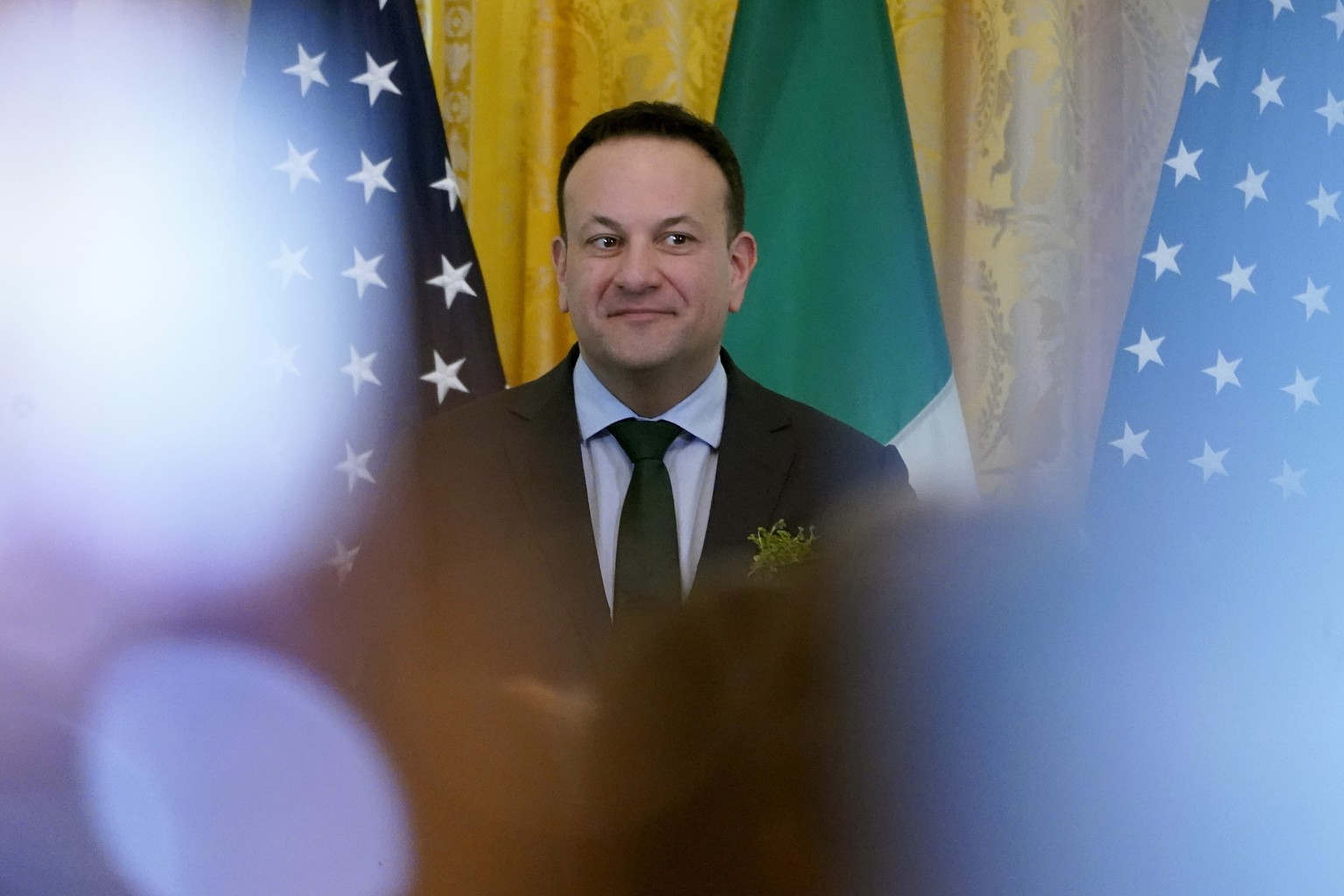 Ireland&#039;s Prime Minister Leo Varadkar listens as President Joe Biden speaks during a St. Patrick&#039;s Day reception in the East Room of the White House, Sunday, March 17, 2024. (AP Photo/Stepha ...