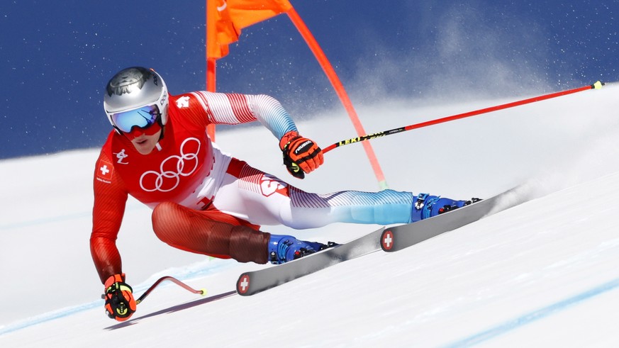 epa09726525 Marco Odermatt of Switzerland in action during the 2nd training run for the Men&#039;s Downhill race of the Alpine Skiing events of the Beijing 2022 Olympic Games at the Yanqing National A ...