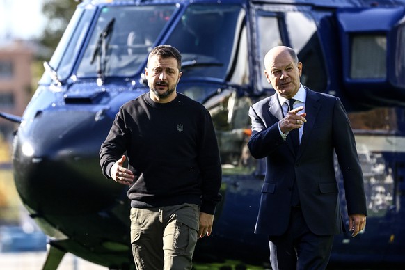 epaselect epa11654665 German Chancellor Olaf Scholz (R) welcomes Ukrainian President Volodymyr Zelensky (L) upon his arrival at the Chancellery in Berlin, Germany, 11 October 2024. Zelensky is on a vi ...