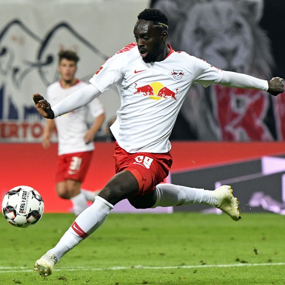 FILE - Leipzig&#039;s Jean-Kevin Augustin scores his side&#039;s 2nd goal during the German first division Bundesliga soccer match between RB Leipzig and VFB Stuttgart in Leipzig, Germany, Wednesday,  ...