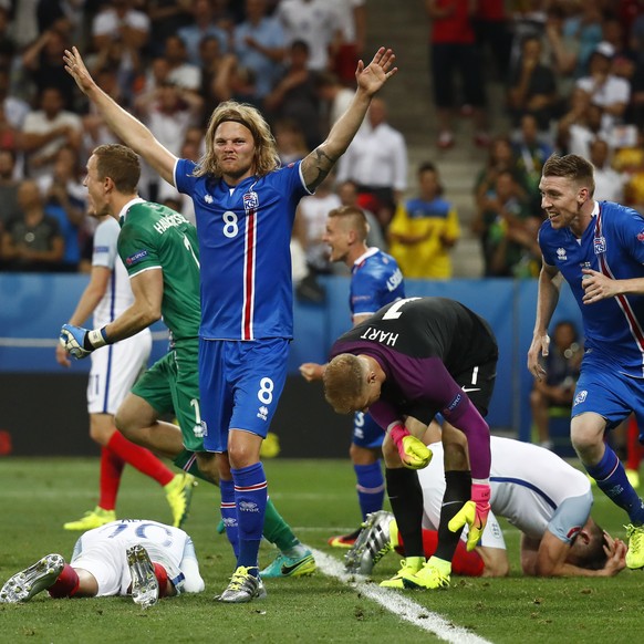 Football Soccer - England v Iceland - EURO 2016 - Round of 16 - Stade de Nice, Nice, France - 27/6/16
Iceland&#039;s Birkir Bjarnason celebrates as England&#039;s Joe Hart and Gary Cahill react after ...