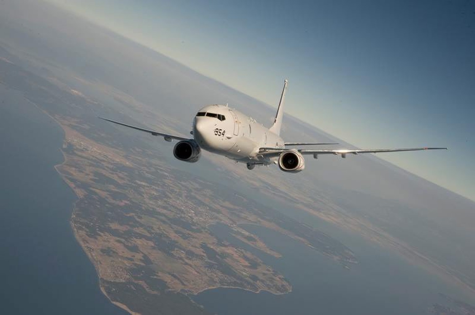 epa04365019 An undated handout photograph made available by the US Department of Defense showing a US Navy P-8 Poseidon in flight. According to the Defense Department, a US aircraft of the same type o ...