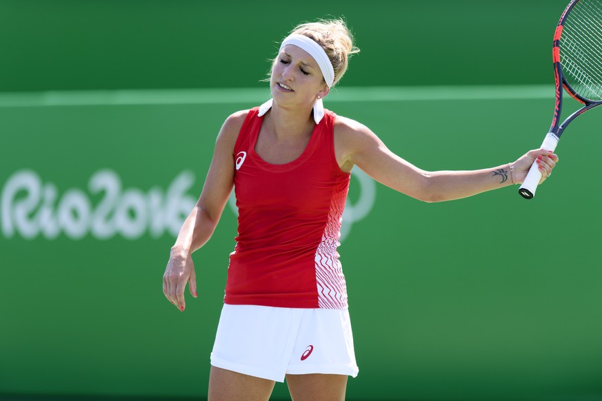 Timea Bacsinszky of Switzerland reacts during the women&#039;s first round singles match against Shuai Zhang from China at the Olympic Tennis Center in Rio de Janeiro, Brazil, at the Rio 2016 Olympic  ...