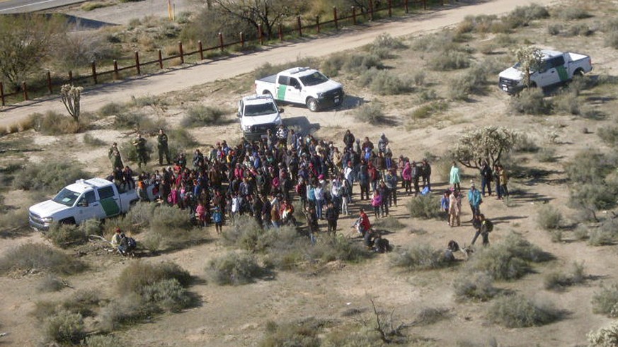 RETRANSMISSION WITHOUT OVERLAY GRAPHIC - In this Thursday, Feb. 7, 2019, aerial image released by the U.S. Customs and Border Protection, migrants, apprehended after illegally crossing along the U.S.- ...