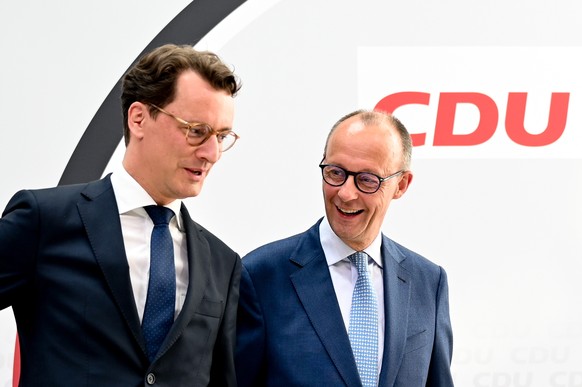 epa09950647 Prime Minister of North Rhine-Westphalia state and CDU top candidate for the NRW state elections Hendrik Wuest (L) and Germany?s Christian Democratic Union (CDU) party and faction chairman ...