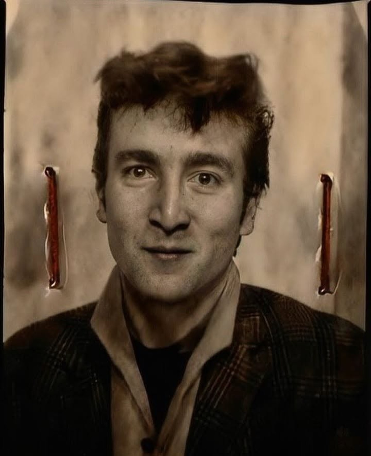 John Lennon's official UK passport photo taken in July/August 1960 - stapled onto his German work visa.

Context:
The Reason: In the summer of 1960, The Beatles (then consisting of John Lennon, P ...
