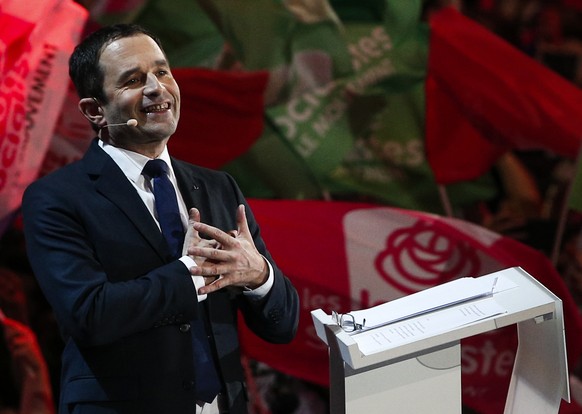 Socialist candidate for the presidential election Benoit Hamon waves to supporters after his speech during a meeting in Paris, Sunday, March 19, 2017. Hamon held a boisterous rally Sunday that packed  ...