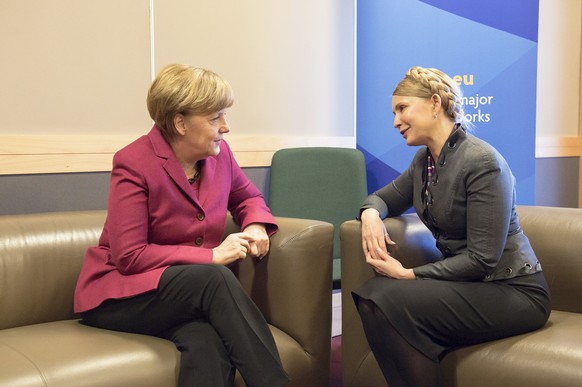 In this picture provided by the German government German Chancellor Angela Merkel, left, meets with Ukrainian politician Yulia Tymoshenko. right, on the occasion of a meeting of the European peoples p ...