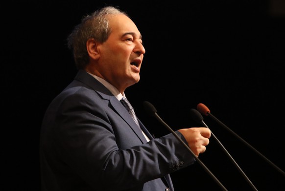 epa10016489 Syrian Minister of Foreign Affairs and Expatriates, Fayssal Mikdad, speaks at a meeting of the Syrian and Russian coordination bodies at the Conferences Palace in Damascus as part of the ...