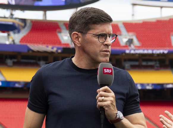 Swiss TV moderator Jeff Baltermia, right, talks to Benjamin Huggel, former national soccer team player an tv expert, one day ahead of the World Cup quarter final match between Argentina and Switzerlan ...