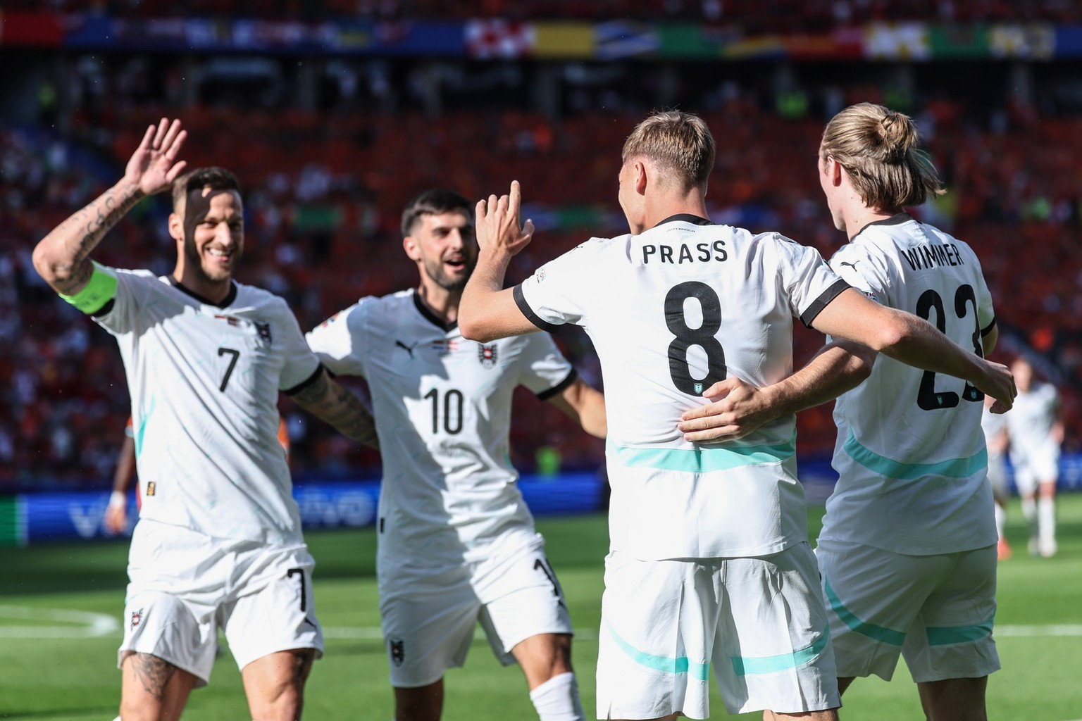 240626 -- BERLIN, June 26, 2024 -- Players of Austria celebrate the own goal from Donyell Malen of the Netherlands during the UEFA EURO, EM, Europameisterschaft,Fussball 2024 Group D match between the ...