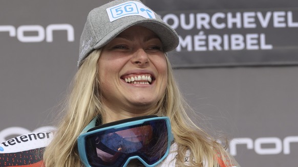 Norway&#039;s Ragnhild Mowinckel celebrates on the podium after winning an alpine ski, women&#039;s World Cup Finals super-G, in Courchevel, France, Thursday, March 17, 2022. (AP Photo/Alessandro Trov ...