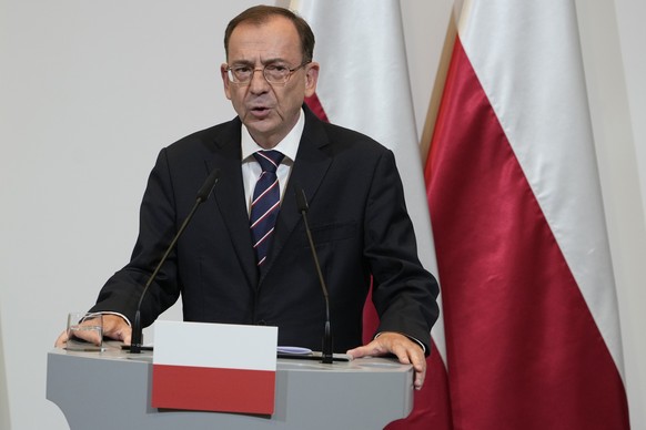 Poland&#039;s Interior Minister Mariusz Kaminski speaks to reporters following talks in Warsaw, Poland, Monday, Aug. 28, 2023. NATO members Poland and the Baltic states will seal off their borders wit ...