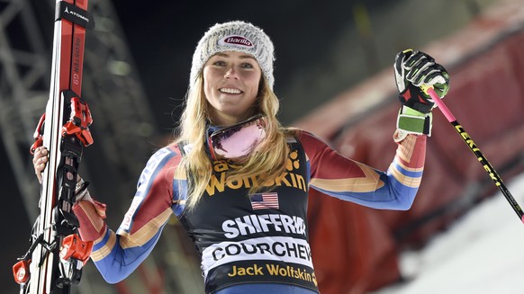 Mikaela Shiffrin of the United States celebrates after winning an alpine ski, women&#039;s World Cup parallel slalom in Courchevel, France, Wednesday, Dec. 20, 2017. (AP Photo/Marco Tacca)