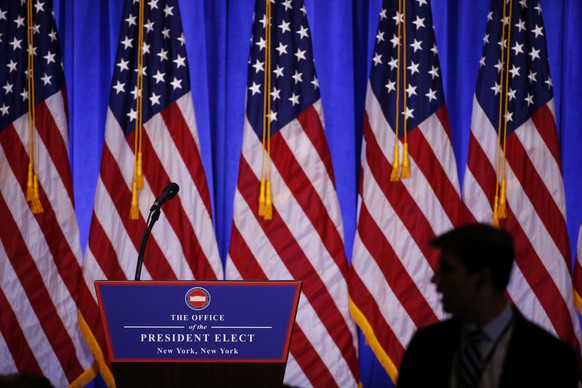 A member of the media waits for U.S. President-elect Donald Trump speaks during a news conference in the lobby of Trump Tower in Manhattan, New York City, U.S., January 11, 2017. REUTERS/Lucas Jackson