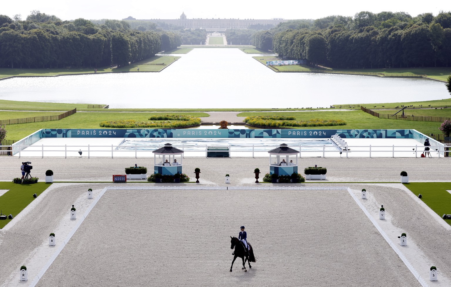 epa11523969 Pauline Basquin of France riding Sertorius de Rima Z competes in the Dressage Individual Grand Prix Freestyle of the Equestrian Dressage competitions in the Paris 2024 Olympic Games, at th ...