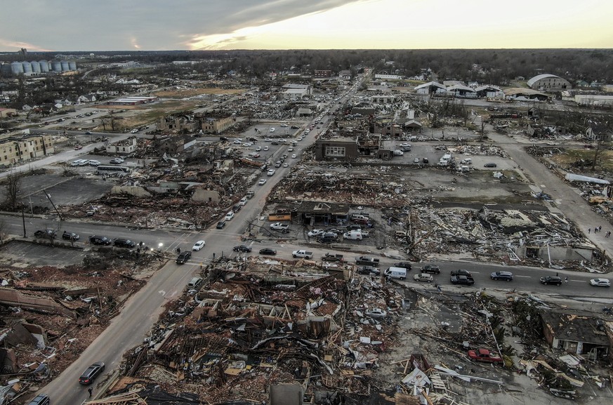 epa09637522 An aerial photo made with a drone shows widespread destruction of homes and businesses after tornadoes moved through the area leaving destruction and death across six states, in Mayfield,  ...