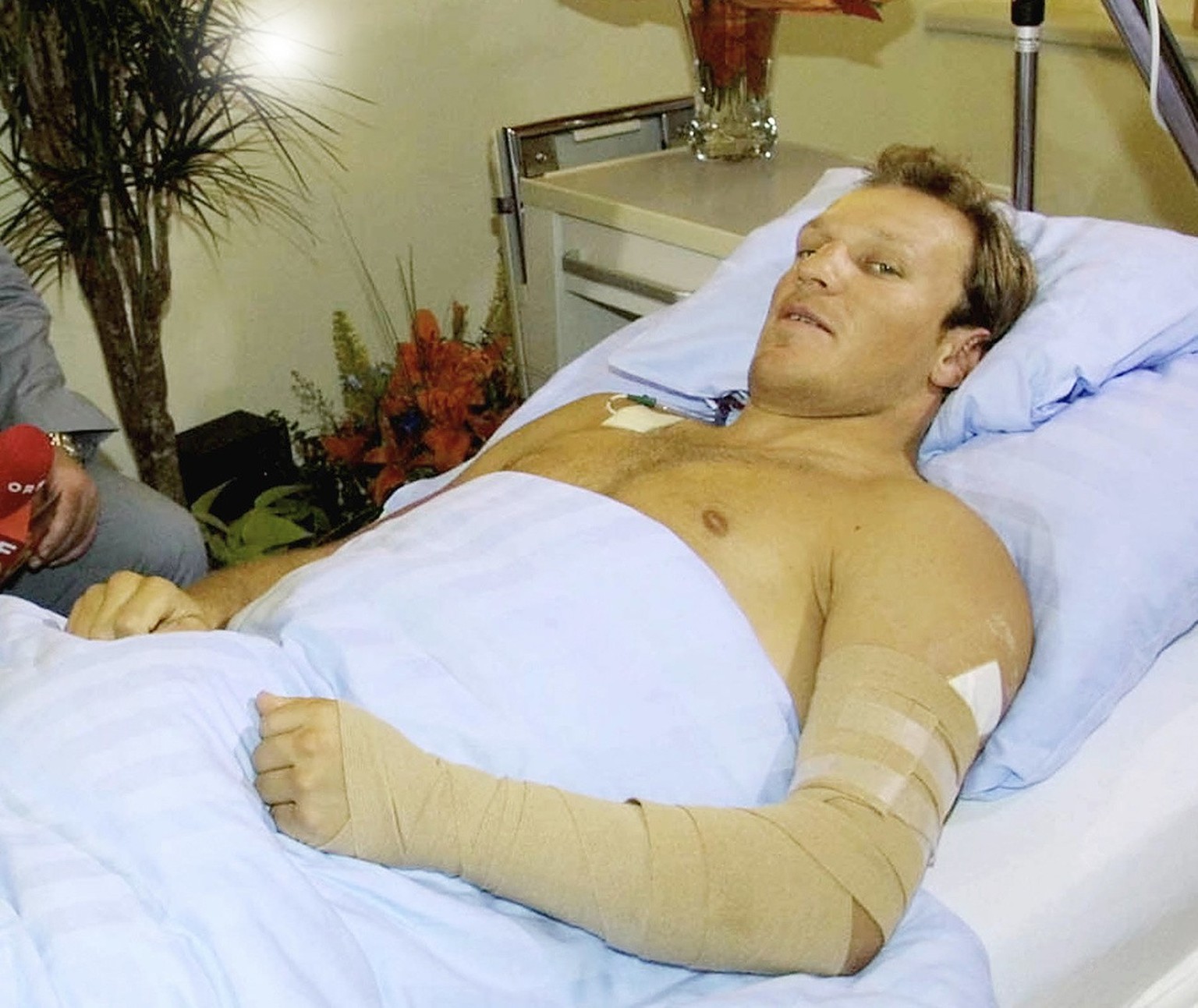 In this Sept. 2, 2001 picture, Hermann Maier speaks from his hospital bed in Salzburg, Austria, giving his first interview after a motorcycle accident that threatens his ski racing career. Austrian sk ...