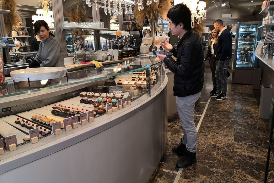 epa08278641 Customers order food at a pastry shop in Padua, northern Italy, 08 March 2020. The Italian authorities have taken the drastic measure of shutting off the entire northern Italian region of  ...