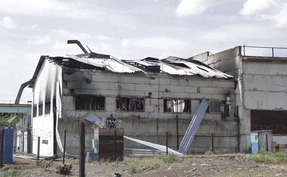 FILE - This image from video shows the damaged barracks at the Russian-controlled Olenivka prison in Olenivka, eastern Ukraine, on July 29, 2022. An AP investigation interviewed survivors, family and  ...