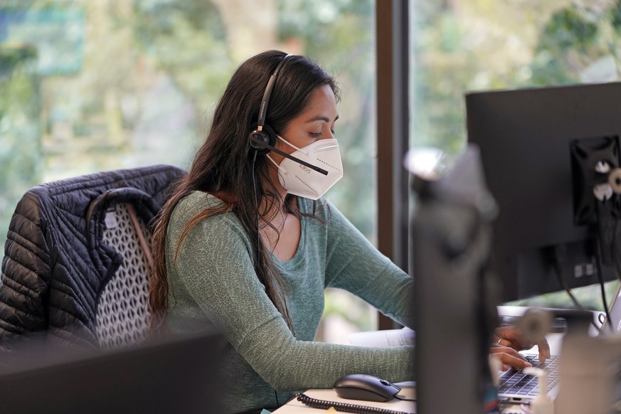 Contact tracer Alejandra Camarillo works at Harris County Public Health contact tracing facility, Thursday, June 25, 2020, in Houston. Texas Gov. Greg Abbott said Wednesday that the state is facing a  ...