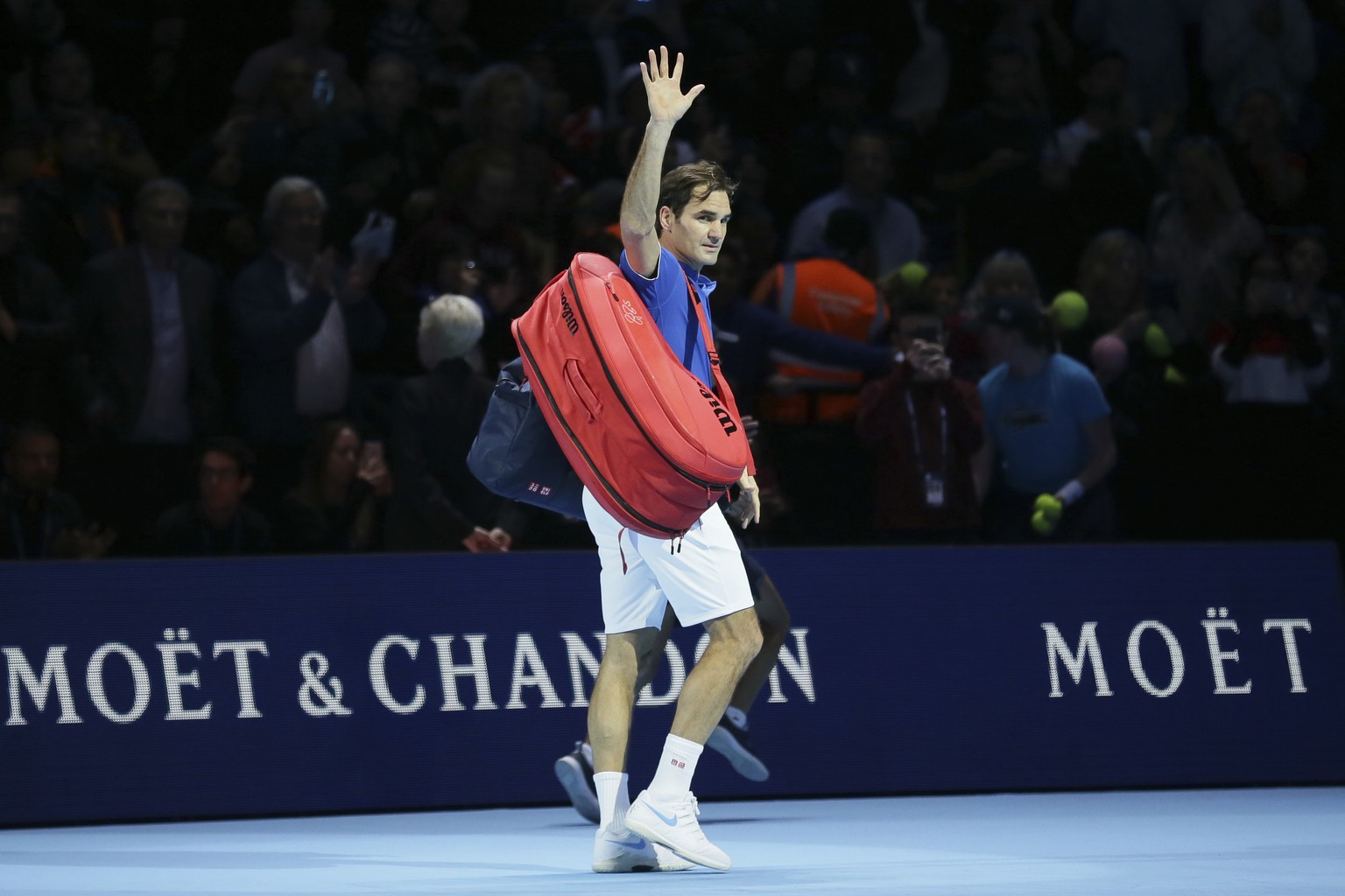 Roger Federer of Switzerland walks off court after losing to Alexander Zverev of Germany in their ATP World Tour Finals singles tennis match at the O2 Arena in London, Saturday Nov. 17, 2018. (AP Phot ...
