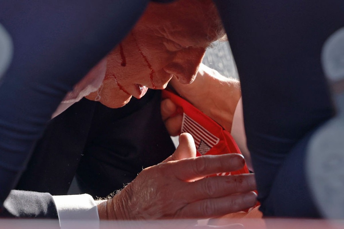BUTLER, PENNSYLVANIA - JULY 13: Secret Service tend to republican presidential candidate former President Donald Trump onstage at a rally on July 13, 2024 in Butler, Pennsylvania. Butler County distri ...