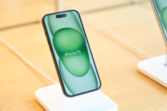 epa11234617 An iPhone 15 is on display inside an Apple retail store in Los Angeles, California, USA, 21 March 2024. The US Justice Department, joined by over a dozen states including California, on 21 ...
