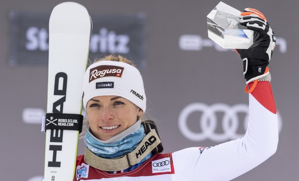 epa09635625 Lara Gut-Behrami of Switzerland celebrates on the podium after winning the women&#039;s Super-G race of the FIS Alpine Skiing World Cup in St. Moritz, Switzerland, 11 December 2021. EPA/PE ...