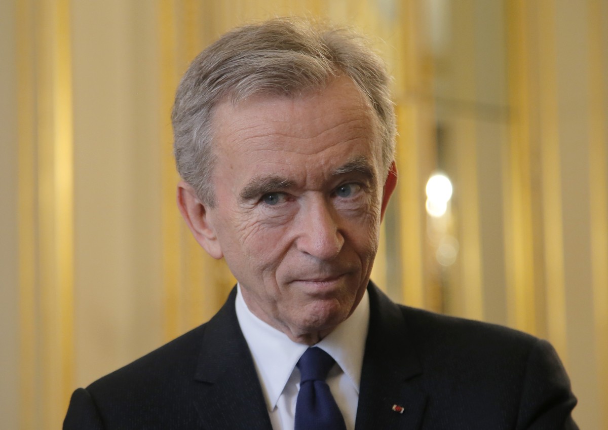 FILE - CEO of LVMH Bernard Arnault listens at the global tech conference Viva Technology at the Elysee Palace in Paris, Tuesday, Feb. 21, 2017. With a major sponsorship role aimed at burnishing the im ...