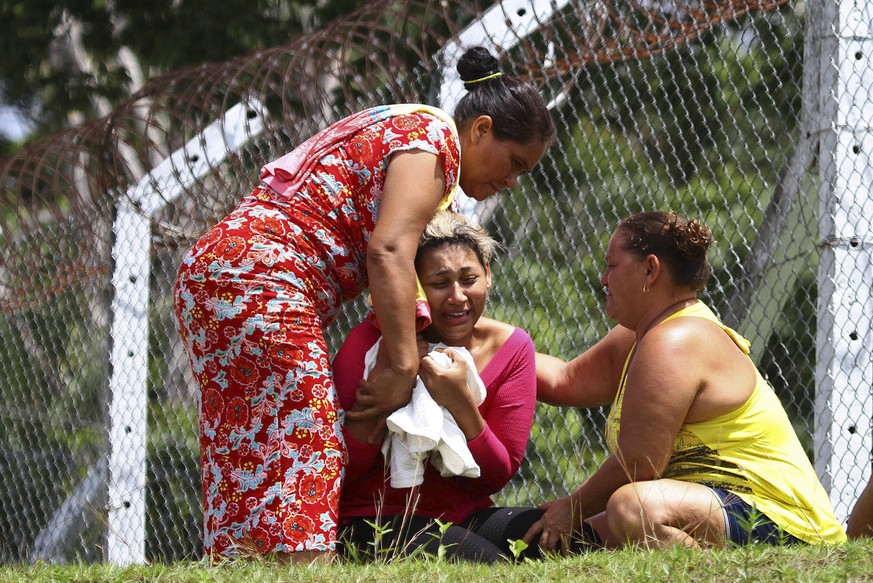 FILE - In this Jan. 2, 2017 file photo, the wife of an inmate who was killed in a prison riot cries outside Anisio Jobim Penitentiary Complex in Manaus, Brazil where dozens of inmates died in the nort ...