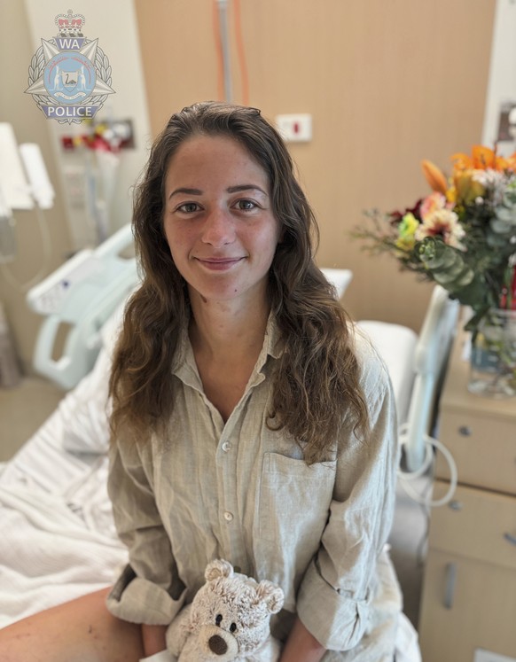 This undated photo released to the media, Monday, July 14, 2025 by Western Australian Police, shows rescued German backpacker Carolina Wilga at her hospital bed in Perth, Western Australia. (Western A ...