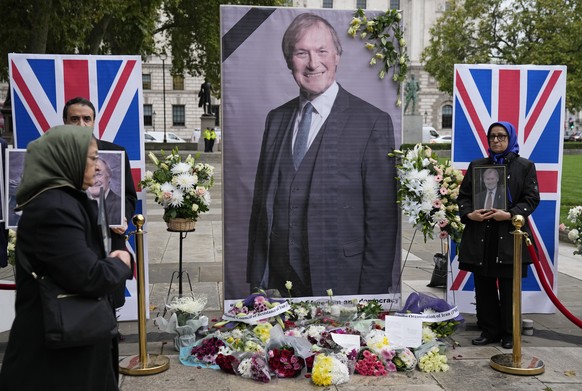 Members of the Anglo-Iranian communities and supporters of the National Council of Resistance of Iran hold a memorial service for British MP David Amess outside the Houses of Parliament in London, Mon ...