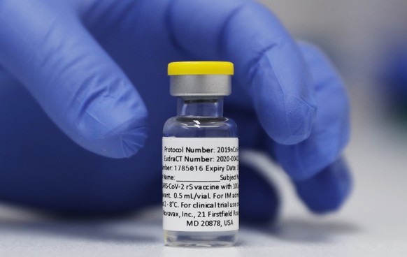 FILE - A vial of the Phase 3 Novavax coronavirus vaccine prepared for use in a trial at St. George&#039;s University hospital in London, Oct. 7, 2020. The Novavax COVID-19 vaccine that could soon win  ...