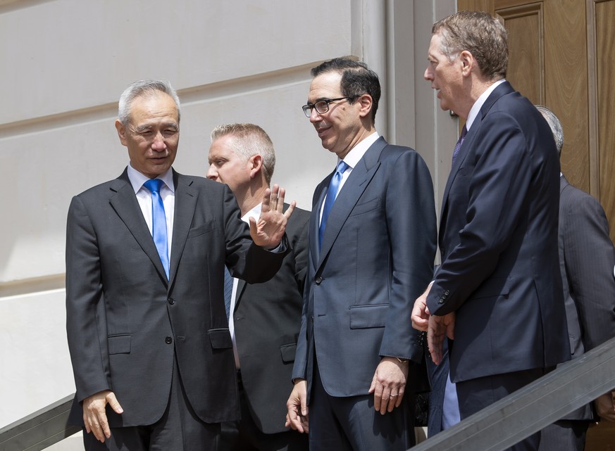 epa07561167 China Vice Premier Liu He (L) says goodbye to US Treasury Secretary Steven Mnuchin (C) and US Trade Representative Robert Lighthizer (R) after trade talks between the two countries at the  ...