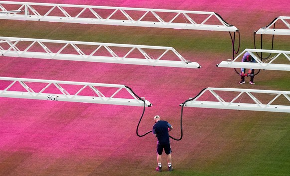 A worker moves a grow light as turf was being installed on the pitch at Houston Stadium, Wednesday, May 27, 2026, in Houston, ahead of the 2026 FIFA World Cup soccer matches. (AP Photo/Karen Warren)
W ...