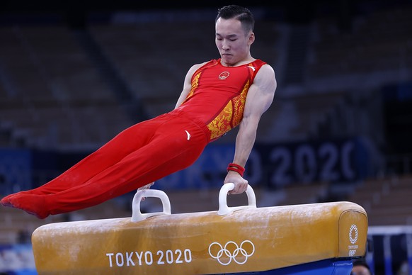 epa09367425 Xiao Ruoteng performs during the men&#039;s Pommel Horse final during the Artistic Gymnastics events of the Tokyo 2020 Olympic Games at the Ariake Gymnastics Centre in Tokyo, Japan, 26 Jul ...