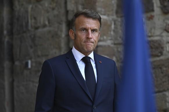 FILE - French President Emmanuel Macron arrives to speak after attending a video conference with members of the so-called &quot;coalition of the willing&quot;, Sunday, Aug. 17, 2025 at the Fort de Bre ...