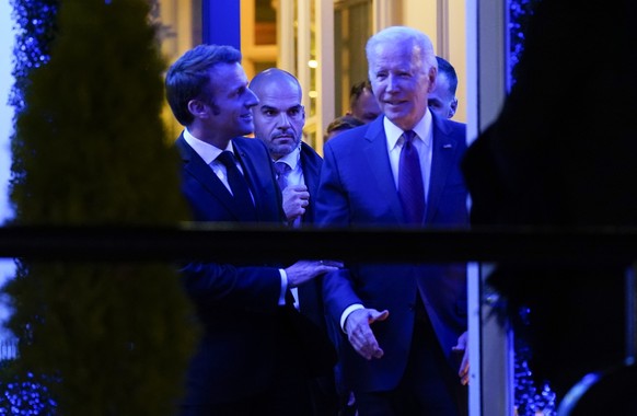 President Joe Biden and French President Emmanuel Macron and his wife Brigitte Macron leave after dinner at Fiola Mare in Washington, Wednesday, Nov. 30, 2022. (AP Photo/Andrew Harnik)