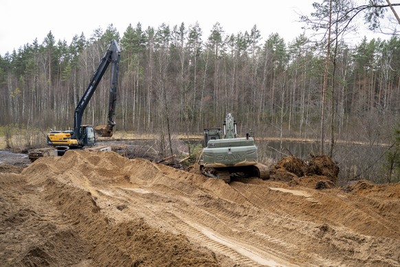 epa11994306 A handout photo made available by the Lithuanian Ministry of National Defense shows the rescue operations at the General Silvestras Zukauskas training ground as the search for four US sold ...
