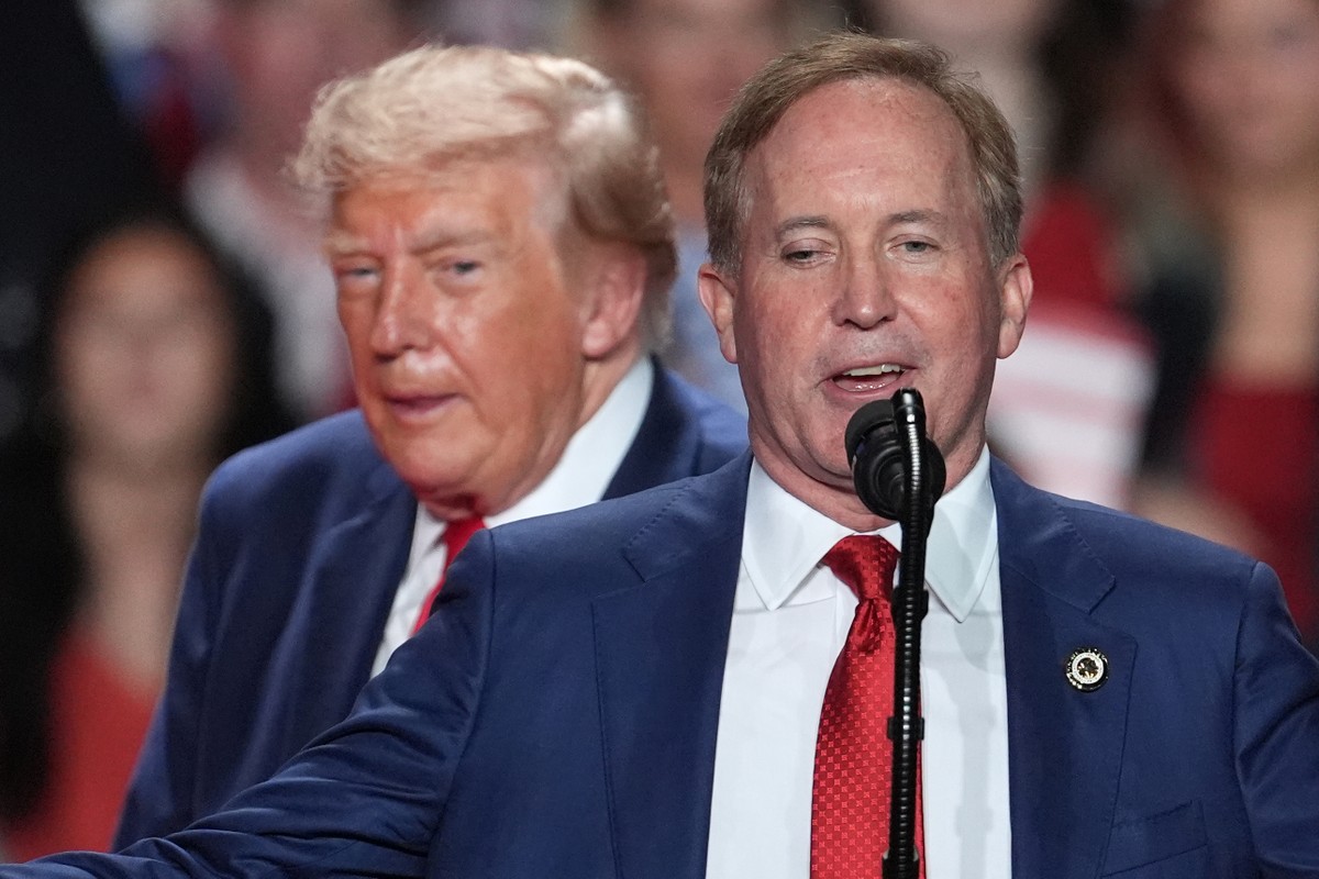 President Donald Trump listens as Republican U.S. Senate candidate Texas Attorney General Ken Paxton speaks at a campaign rally at the Freeman Coliseum in San Antonio, Wednesday, Oct. 7, 2026. (AP Pho ...